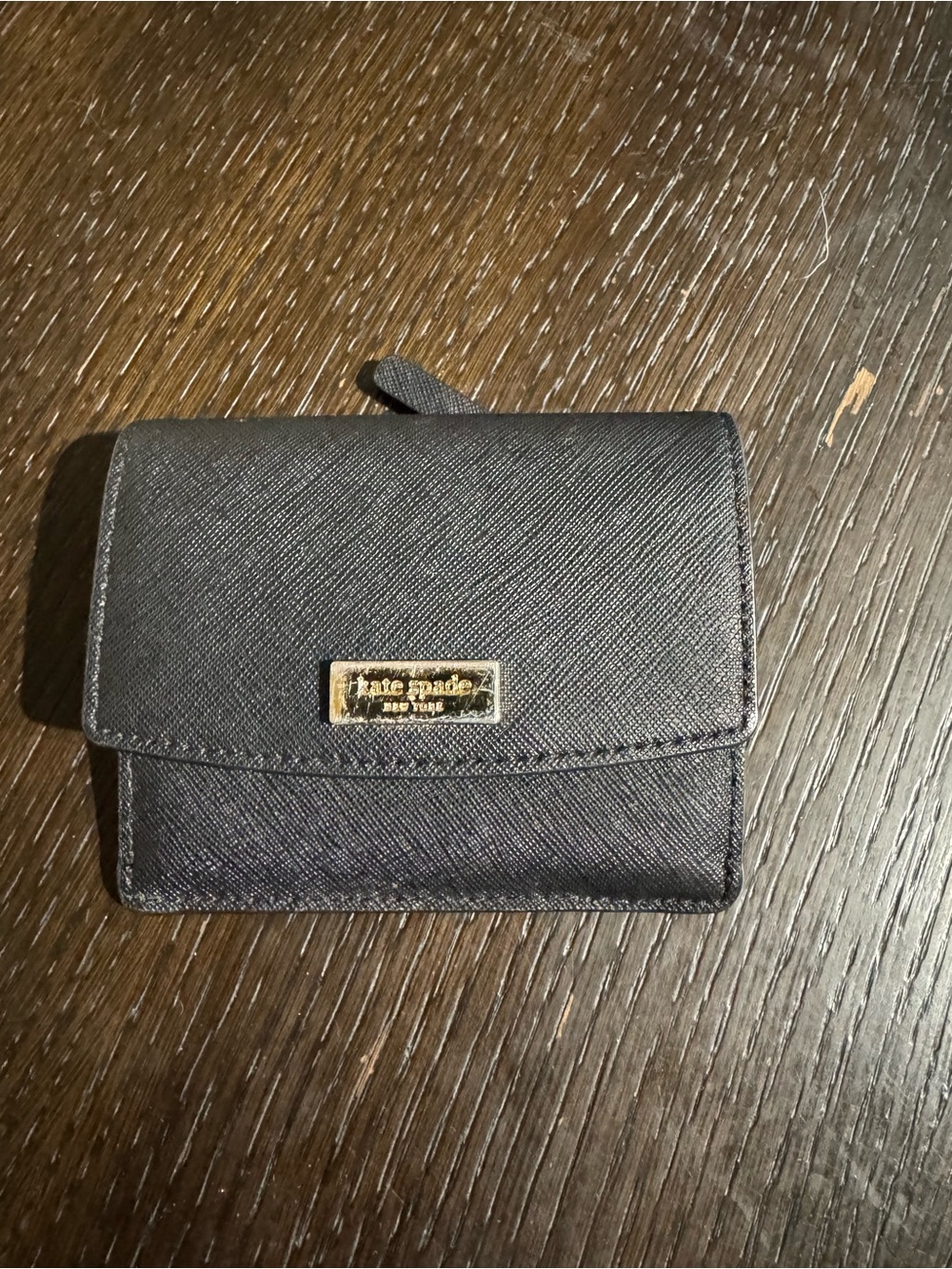 kate spade black compact Saffiano flap wallet with gold plaque